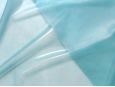 Front and backside of sky blue semi-transparent latex rubber material. thumbnail image.